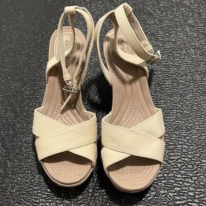 Crocs, women UNWORN wedge. About 3 inch wedge. Size 7.
